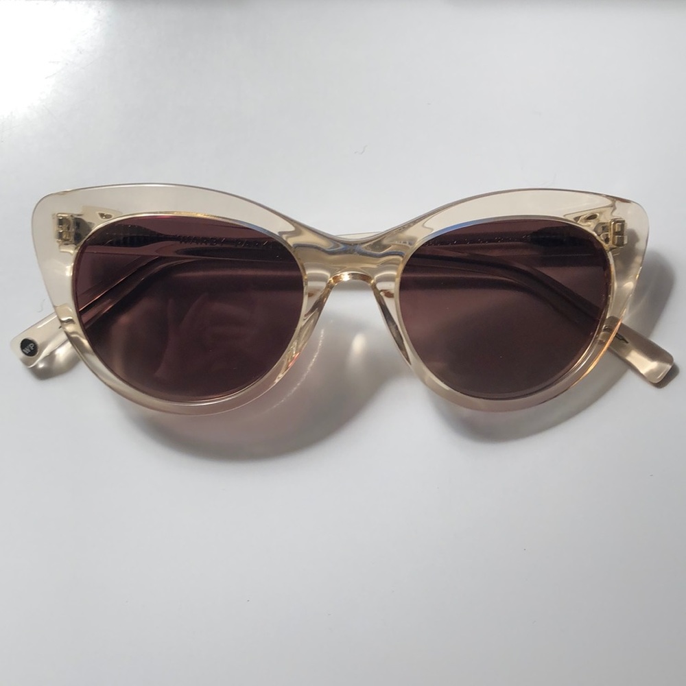Warby Parker Tilley rose-colored sunglasses.